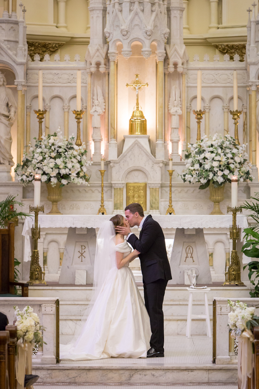 Bride and Groom First Kiss at Wedding Altar | Downtown Tampa Wedding Ceremony Venue Sacred Heart Catholic Church