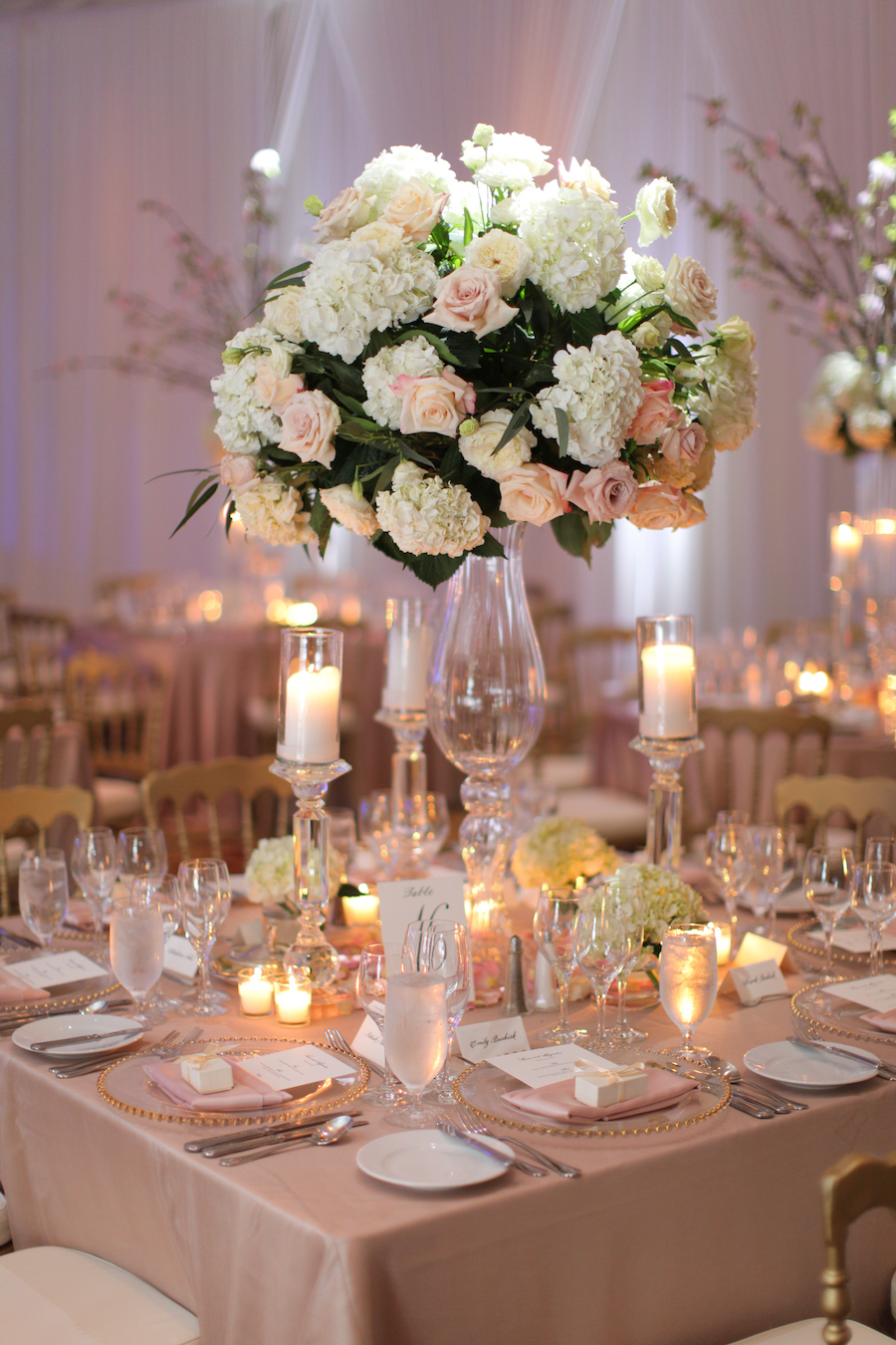 Wedding Reception Decor with Glass Beaded Chargers, Candles and Tall, White Floral Centerpieces