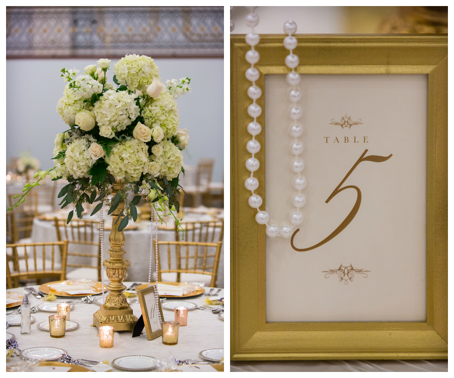 Tall White and Ivory Floral Wedding Centerpieces on Gold Stand Draped with Pearls by Northside Florist and Gold Framed Table Numbers | Downtown Tampa Wedding Reception, Floridan Palace Hotel