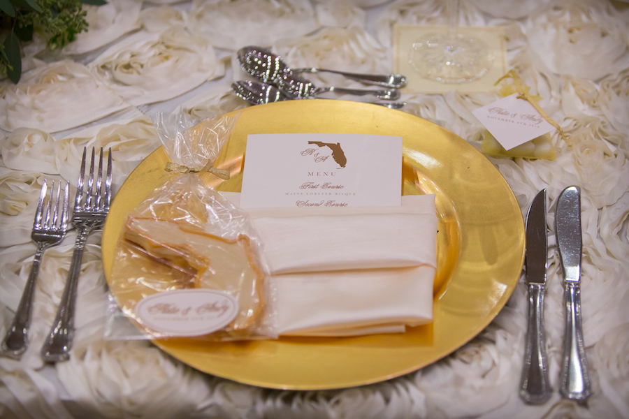Gold, Wedding Reception Plate Chargers with on Floral Rose Design, Ivory Table Linens by Kate Ryan Linens and Florida Shaped Wedding Favor Cookies by Alessi Bakeries