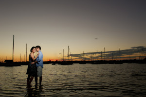 Sunset, Waterfront Engagement Portrait with Boats in Silhouette