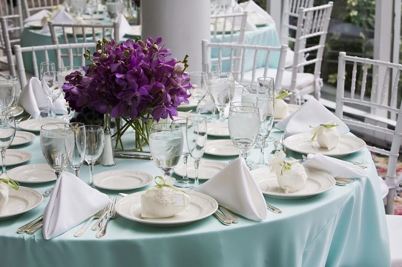 Elegant Wedding Reception Dishes and Place Setting at Tampa Bay Wedding Reception on Teal Linens Tablecloths with White Chiavari Chairs | St. Petersburg Wedding Rentals Rent-All City