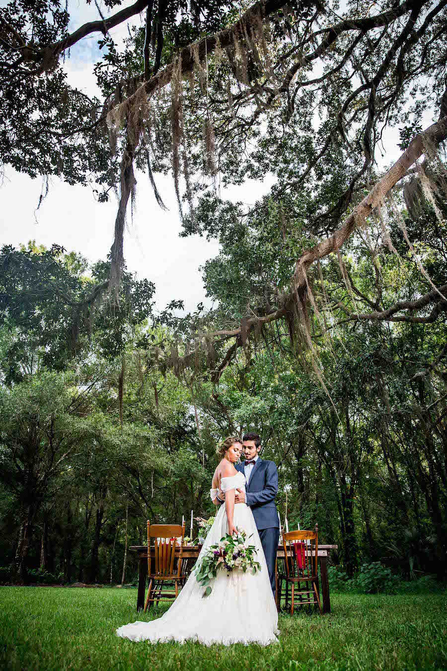 Bride wearing Amsale wedding dress from Blush Bridal Sarasota and Groom Portrait | Southern Inspired Outdoor Wedding Reception Decor Styled Shoot