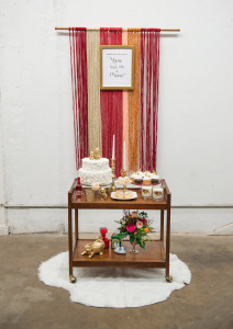 Cat Themed Tampa Bay Wedding Reception Cake and Dessert Bar Cart with White Fur Accent and Yarn Backdrop at Tampa Bay Wedding Venue Rialto Theatre | Fur Rental from Tampa Bay Wedding Rental Company Kate Ryan Linen | Wedding Cake from Tampa Bay Bakery Cakes Tampa | Styled by Tampa Bay Wedding Designer Ever After Vintage Weddings | Tampa Bay Wedding Photographer Artful Adventures Photography