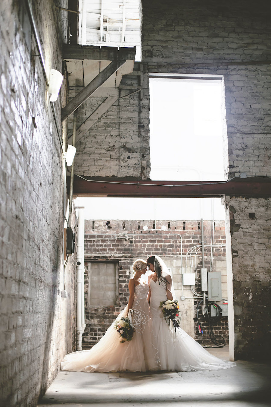 Same Sex Gay Brides in Blush and Ivory Strapless Wedding Gowns Wedding Portrait | Tampa Wedding Venue Rialto Theater | Wedding Photographer FotoBohemia