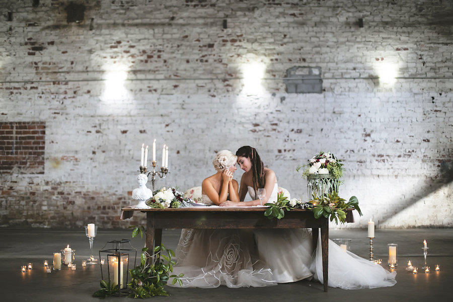 Same Sex Gay Couple at Vintage Wooden Sweetheart Table at Wedding Reception, Surrounded by Candlelight and Flowers Bohemian/Boho Styled Wedding Shoot | Tampa Wedding Photographer FotoBohemia