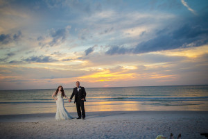 Destination Beach Bride and Groom Wedding Portrait at Sunset | Outdoor St Pete Beach Wedding at Loews Don CeSar | Kleinfeld Bridal Strapless Beaded Wedding Dress