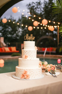 Four, Tiered Ivory Wedding Cake with Peach Floral Accent and Mr and Mrs Cake Topper