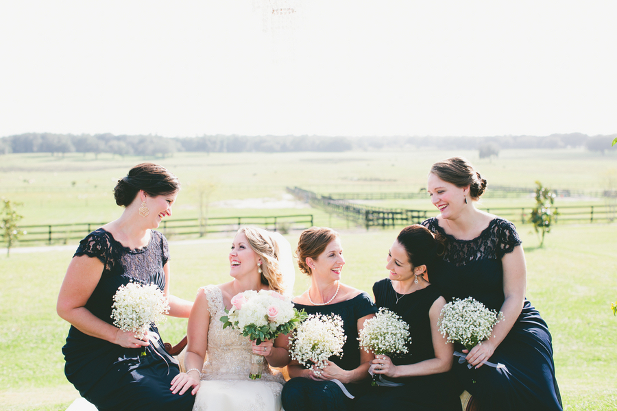 Bride and Bridesmaids Outdoor Rustic Tampa Bay Wedding Portrait in Navy Bridesmaids Dresses