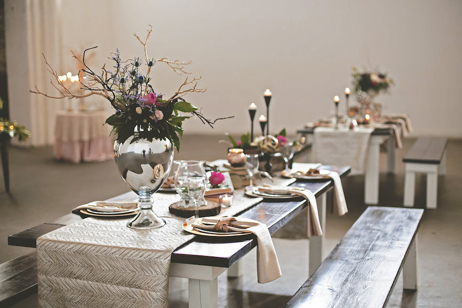 Wooden Farm Tables with Candles, Gold Chargers, and Flowers Wedding Reception Decor | Downtown Tampa Wedding Venue Rialto Theater | Bohemian/Boho Styled Wedding Shoot