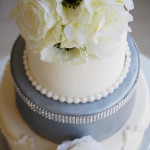 Custom Dusty Blue Wedding Cake with White Top Tier with Accent of White Flowers and Swarvoski Accent |Tampa Bay Wedding Cake Designer Sweet Tooth Cakery