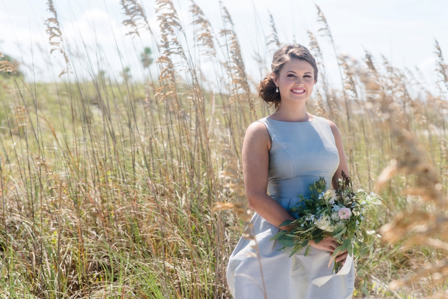 St. Pete Beach Bridesmaid in Grey Dessy Bridesmaid Dress with Lush Greenery Bouquet | Tampa Bay Wedding Photographer, Caroline & Evan Photography| Tampa Bay Wedding Hair & Makeup By Lasting Luxe Hair & Makeup