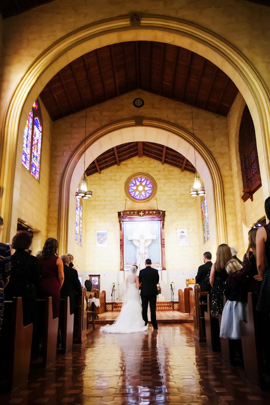 Bride and Groom at Church Altar During Wedding Ceremony| St. Leo Abbey Church Tampa Bay Wedding Venue| Photo by Tampa Bay Wedding Photographer Limelight Photography