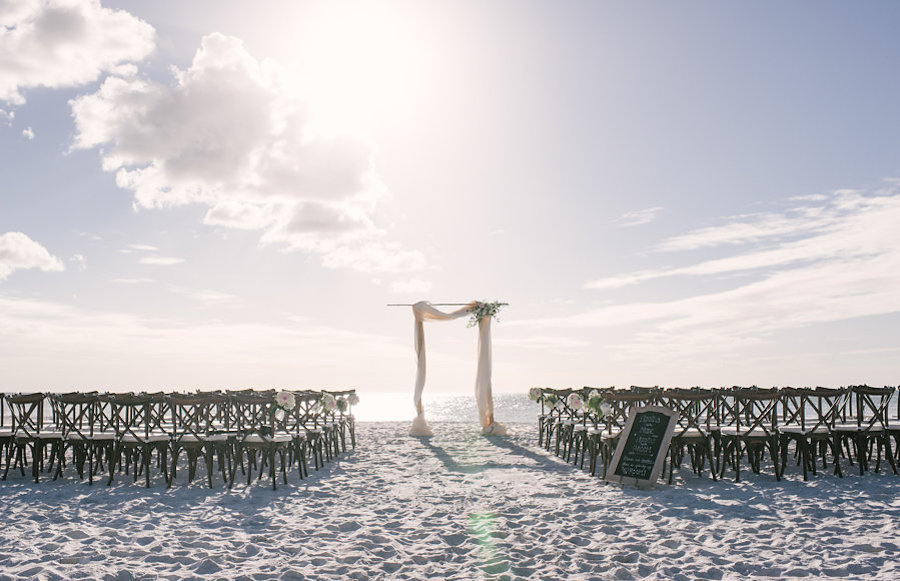 Beach Wedding with Wooden Chairs and Bamboo Arch | Sunset Beach Resort, Siesta Key, Florida | Sarasota Wedding Planner Kimberly Hensley Events