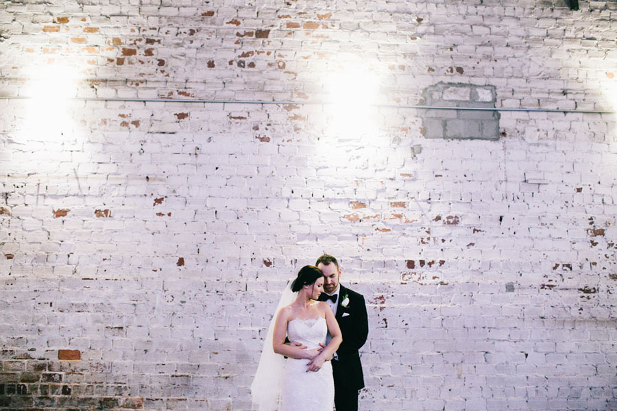 Bride and Groom Wedding Portrait with White Industrial Brick Wall | Downtown Tampa Wedding Venue The Rialto Theatre