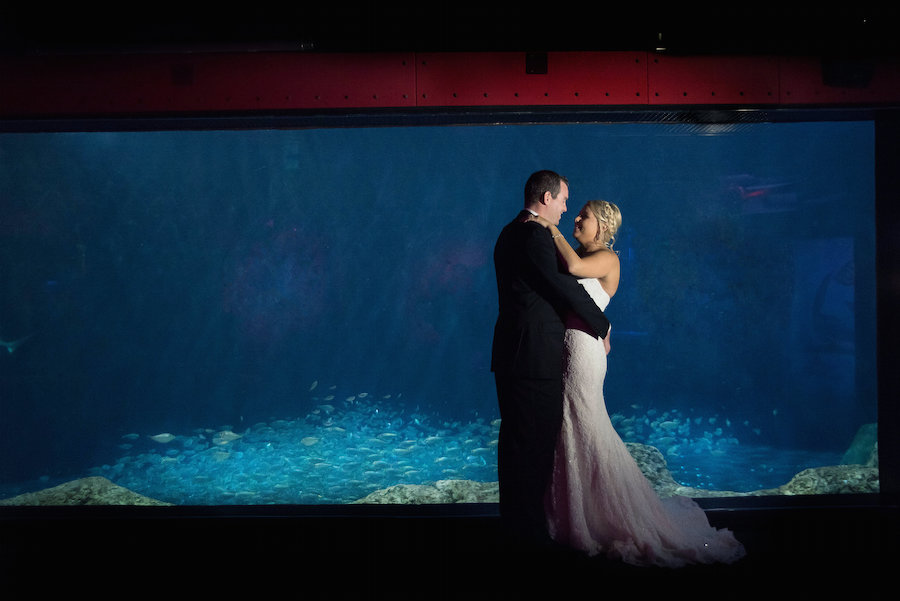 Bride and Groom Fish Tank Wedding Portrait at Unique Downtown Tampa Wedding Venue The Florida Aquarium | Photo by Tampa Bay Wedding Photographer Kristen Marie Photography