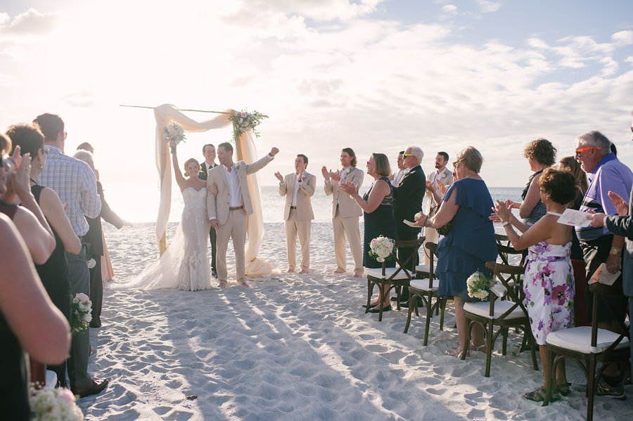 Bride and Groom Celebrating During Wedding Ceremony | Sarasota Siesta Key Beach Ceremony Recessional | Sarasota Wedding Planner Kimberly Hensley Events