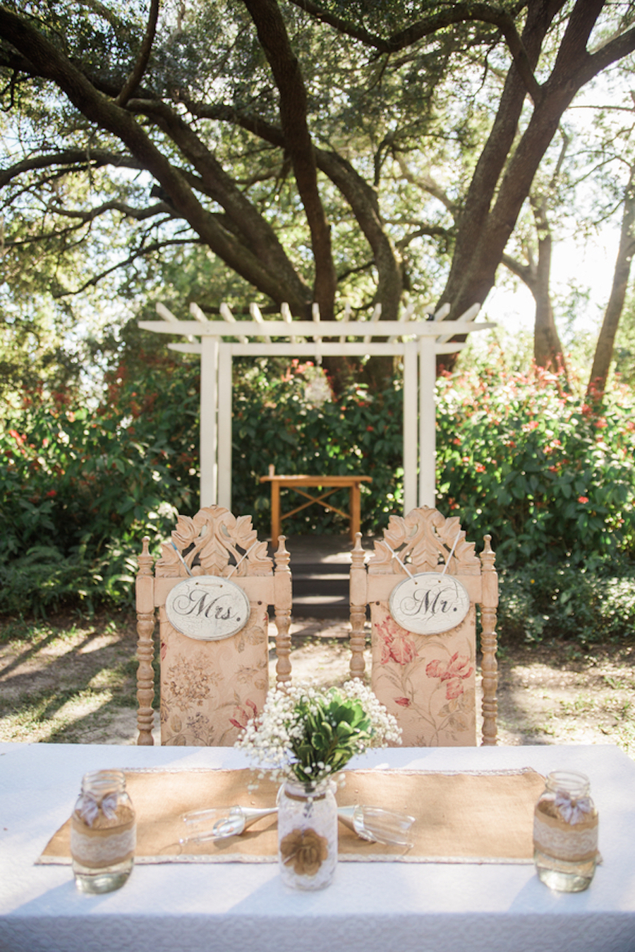Burlap and Lace Mason Jar Centerpieces | Rustic Outdoor Tampa Bay Wedding Sweetheart Table with Mr and Mrs Signs and Vintage Chairs