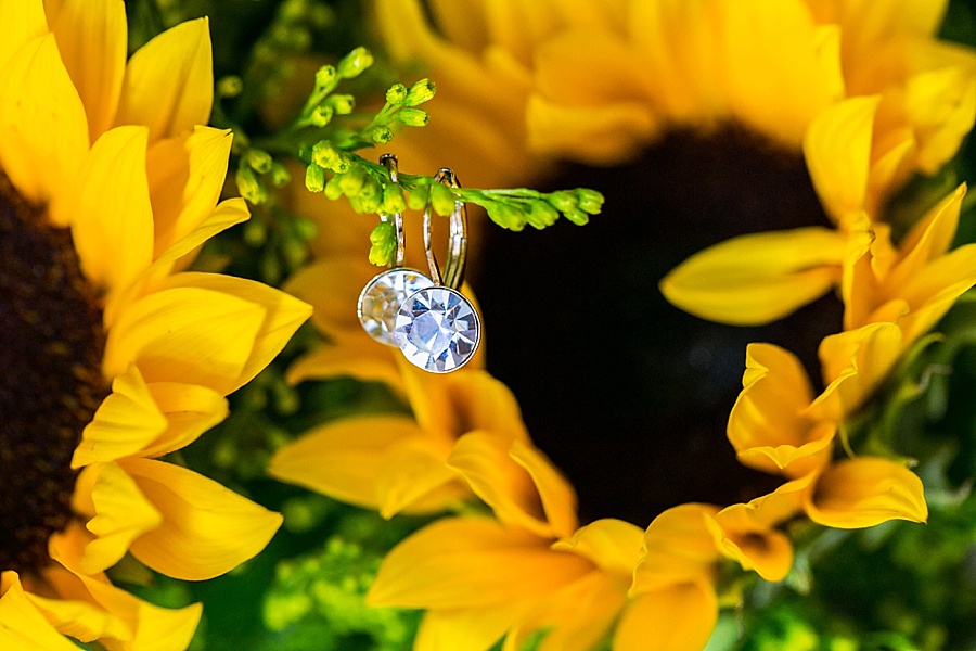 Getting Ready Details: Diamond Wedding Earring Detail with Yellow Sunflower Bouquet