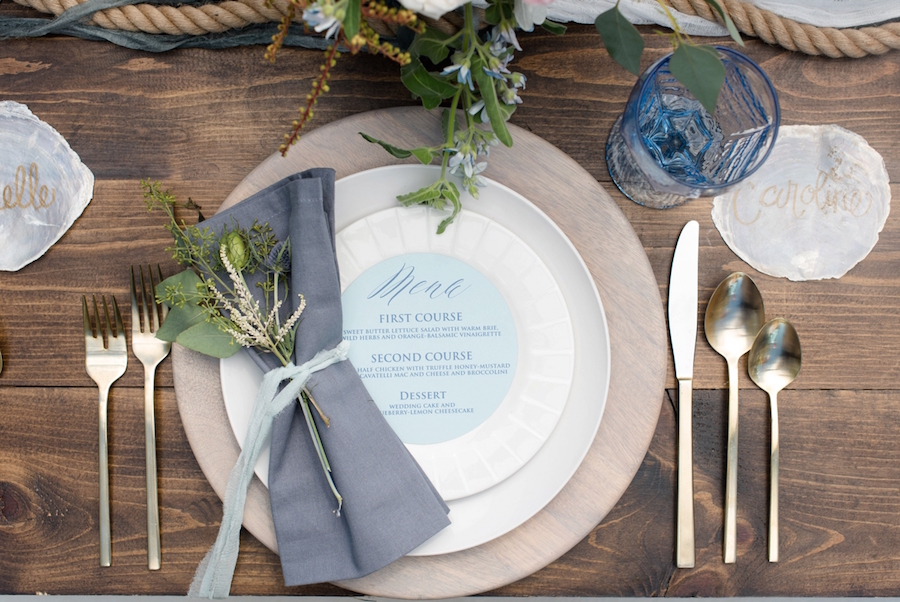 Coastal Inspired Wedding Menu and Place Setting Design with Nautical Floral Accent and Wooden Chargers on Farm Table | Tampa Bay Wedding Photographer, Caroline & Evan Photography