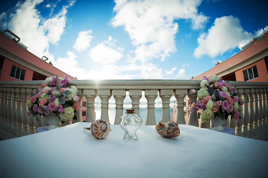 Clearwater Beach Wedding Ceremony Details with Seashells, Sand Ceremony Vase, and Purple, Pink, and Ivory Flowers | Clearwater Beach Wedding Photographer Limelight Photograph