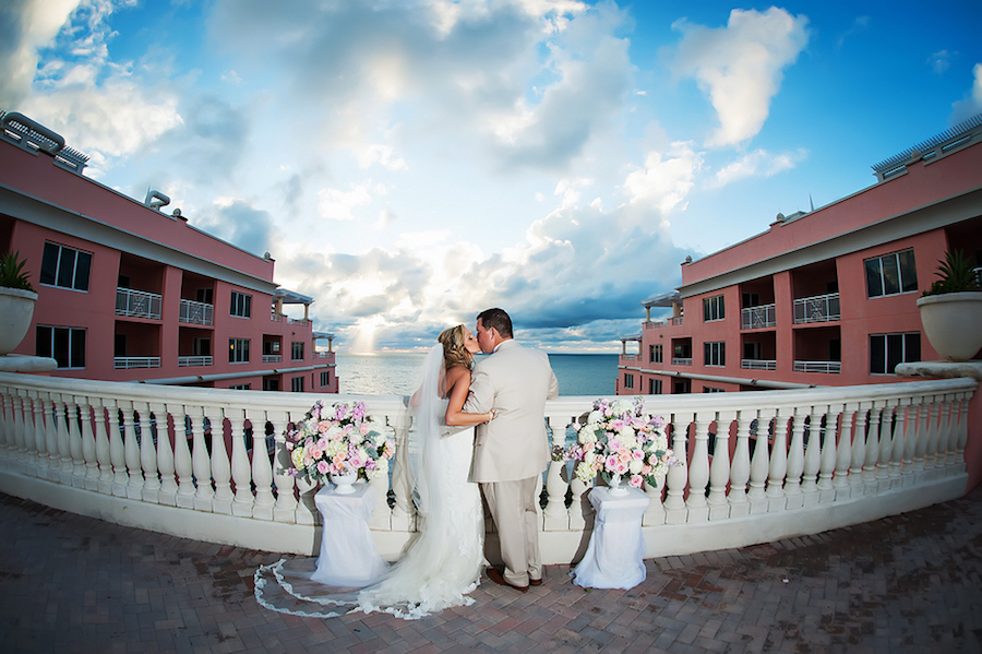 Bride and Groom Kissing Wedding Portrait, Terrace of the Clearwater Beach Hyatt Regency Hotel | Clearwater Beach Wedding Photographer Limelight Photograph