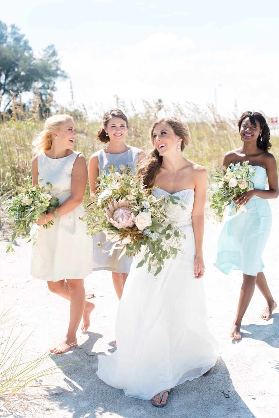 St. Pete Beach Coastal Wedding Portrait, Bride with Bridesmaid in Dessy Bridal Gowns at Beach Wedding| Tampa Bay Wedding Photographer: Caroline & Evan Photography | Tampa Bay Wedding Hair & Makeup By Lasting Luxe Hair & Makeup