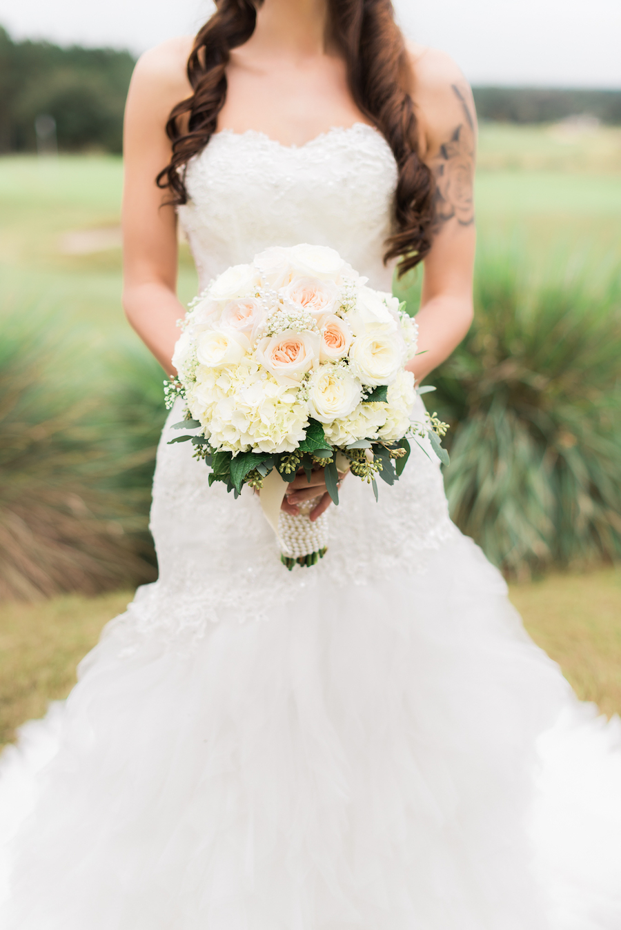 utdoor, Bridal Wedding Portrait in Ivory, Lace Strapless Wedding Gown and Ivory and Blush Pink Wedding Bouquet of Flowers