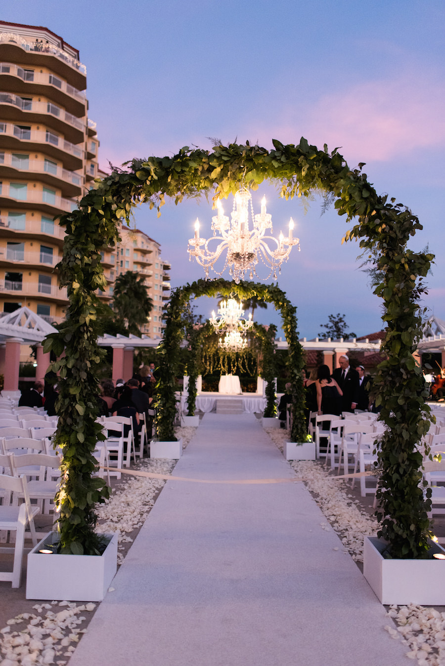 Outdoor Wedding Ceremony Decor with Green, Hanging Garland Archways and Chandeliers | St. Petersburg Wedding Venue The Renaissance Vinoy Hotel