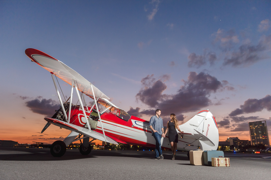 Travel Inspired St. Pete Engagement Portrait Photography with Airplane at Sunset with Vintage Luggage | St. Petersburg Wedding Photogrpaher Marc Edwards Photographs