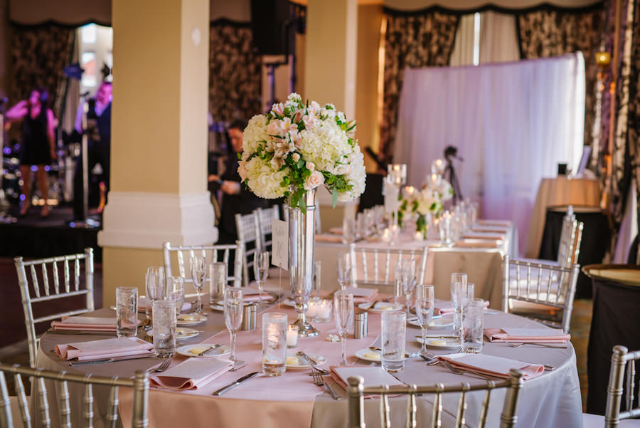 Wedding Reception Decor with Silver Chiavari Chairs and Tall, Ivory and Pink Flower Centerpieces | St. Pete Wedding Planner Kimberly Hensley Events