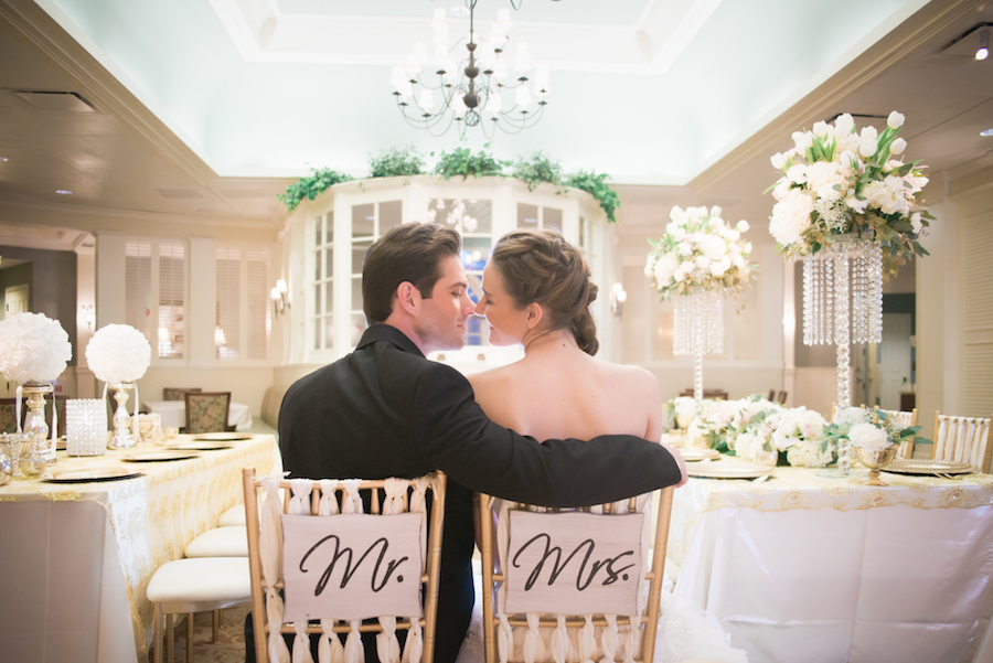 Bride and Groom in Mr and Mrs Sweetheart Table Chair Signs |Tampa Bay Brooksvile Wedding Reception at Southern Hills Plantation Club