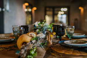 Ybor City Wedding Reception Decor with Black Glassware, Nautical Plates, Floral Garland and Buoy