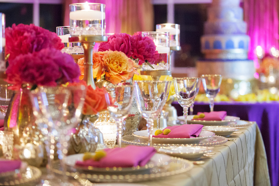 St. Petersburg Indian Wedding Reception Table Decor with Pink and Yellow Flower Centerpieces Gold Linens and Candles | St. Petersburg Wedding Florist Iza's Flowers