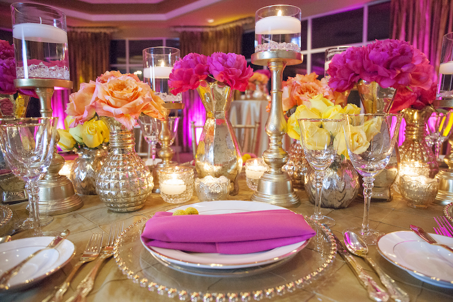 St. Petersburg Indian Wedding Reception Table Decor with Pink and Yellow Flower Centerpieces Gold Linens and Candles | St. Petersburg Wedding Florist Iza's Flowers
