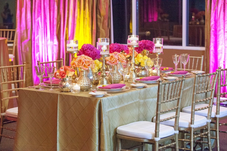 St. Petersburg Indian Wedding Reception Table Decor with Pink and Yellow Flower Centerpieces Gold Linens and Candles | St. Petersburg Wedding Florist Iza's Flowers