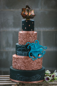 Black and Gold 5 Tiered Nautical Inspired Wedding Cake with Pirate Ship and Octopus Details | Tampa Wedding Cake Chefin Parties