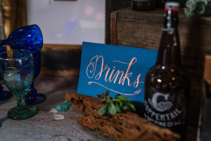 Drinks Table Card with Beer Growler and Sea Glass | Coppertail Brewing Co
