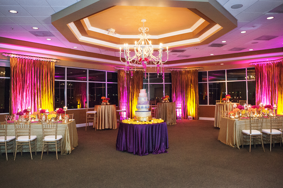 Indian Wedding Reception with Gold and Pink Centerpieces and Purple Wedding Cake | St. Petersburg Wedding Florist Iza's Flowers | Waterfront St. Pete Wedding Venue Isla del Sol Yacht and Country Club