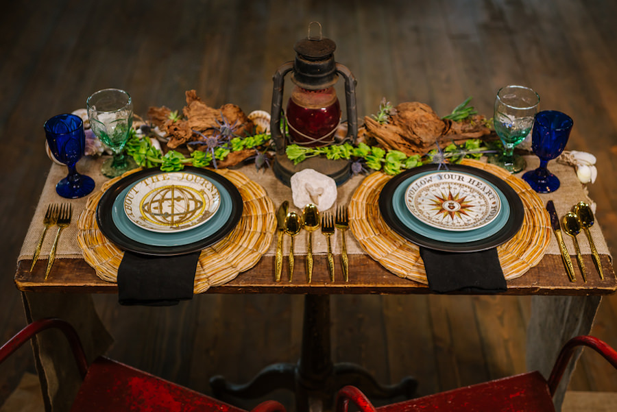 Industrial, Nautical Inspired Wedding Details with Gold Utensils, Cobalt Glassware, and Navigation Detailed Place Settings