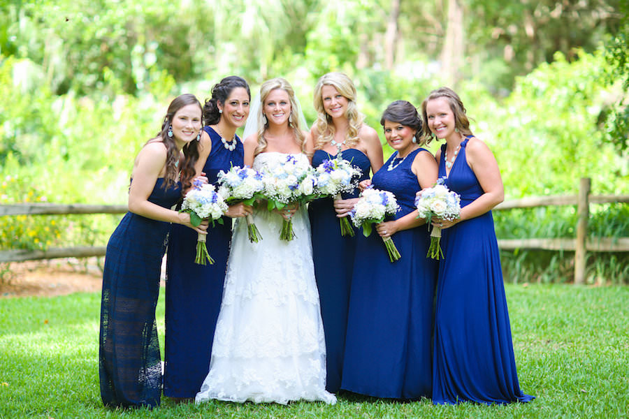 Bride and Bridesmaids Bridal Wedding Portrait with Ivory, Strapless Wedding Gown and Blue Bridesmaids Dresses with White and Purple Wedding Bouquets