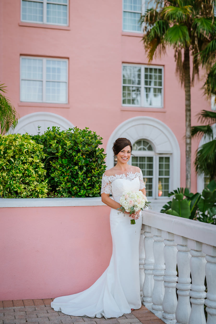 Outdoor, Bridal Wedding Portrait in Off the Shoulder, White, Lace Wedding Gown with Ivory and Pink Wedding Bouquet of Flowers | St. Pete Beach Hair and Makeup Lasting Luxe