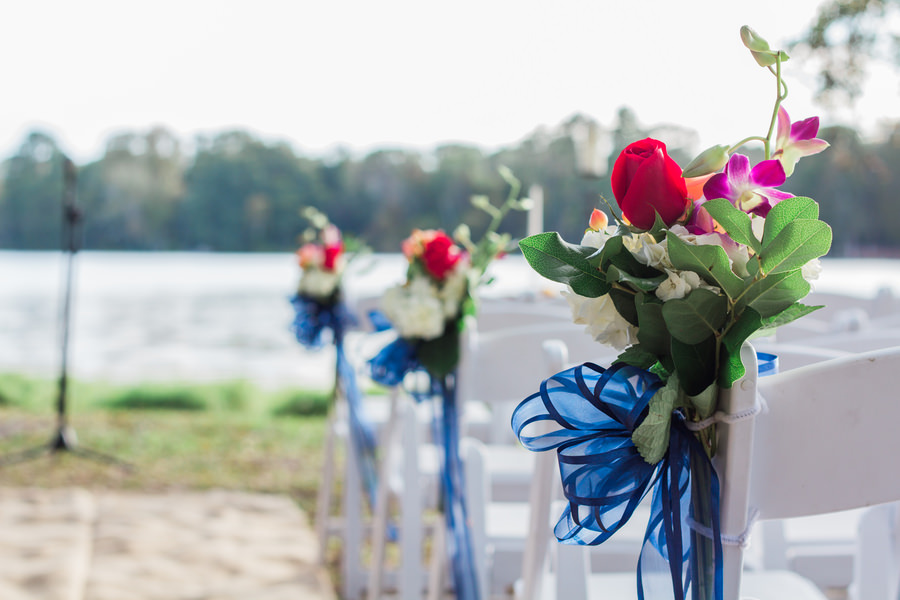 Outdoor Tampa Bay Wedding Ceremony with Red Flowers | Outdoor Wedding Venue The Barn at Crescent Lake