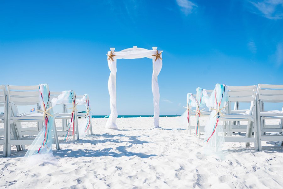 Clearwater Wedding Ceremony Altar with White Draped Linen and Starfish | Clearwater Wedding Venue Hilton Clearwater Beach