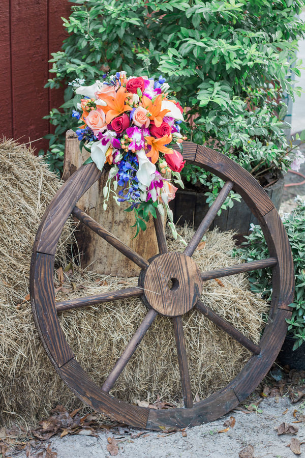 Rustic, Wooden Wheel with Colorful Orange and Pink Floral Bridal Wedding Bouquet