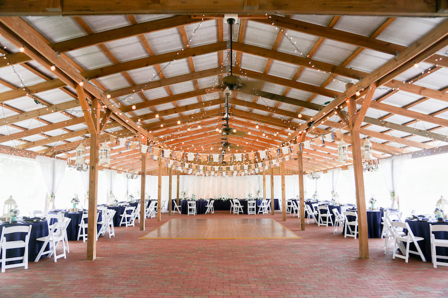 Tampa Bay Wedding Venue Cross Creek Ranch Barn Reception with Rustic Wood and String Lighting