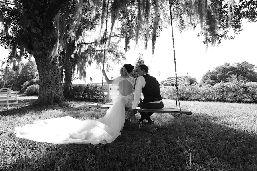 Florida Bride and Groom Outdoor Wedding Portrait on Swing | Rustic Lakeland Wedding Venue Rocking H Ranch