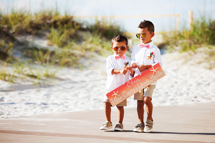 Clearwater Beach Wedding Ceremony Ring Bearers Walking Down Aisle with Here Comes Your Bride Sign