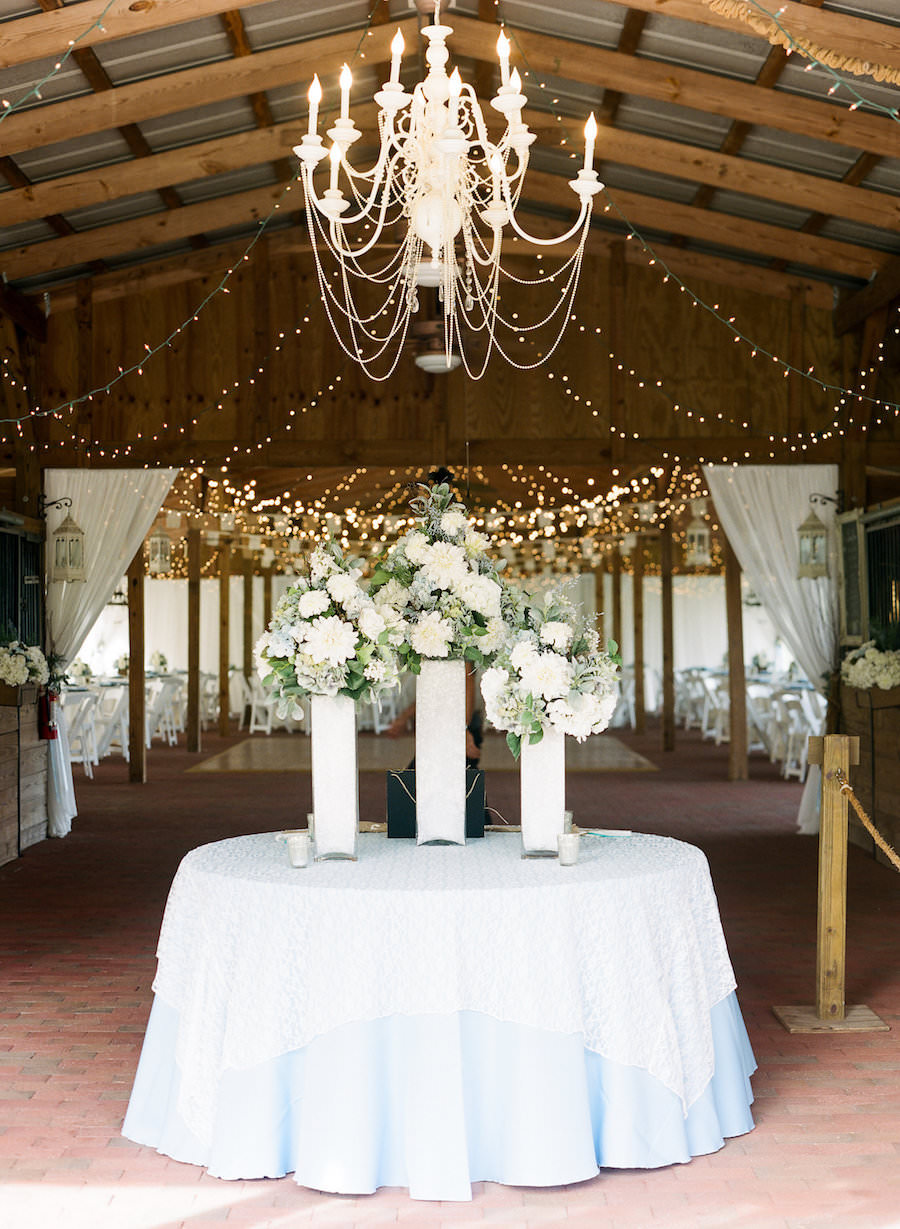 Elegant Rustic Outdoor Tampa Wedding Reception with Chandelier and Cafe Lighting |Cross Creek Ranch Tampa Wedding Venue