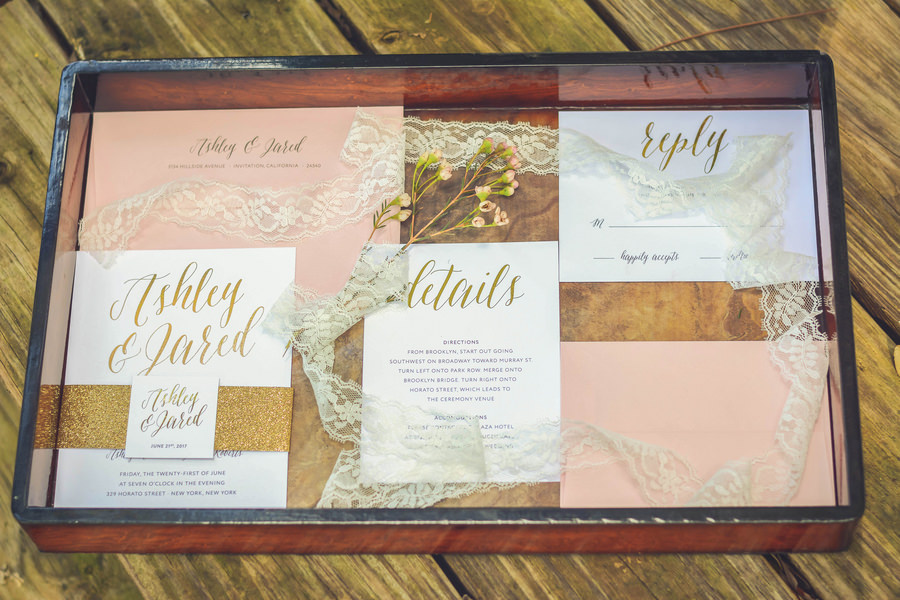 Blush, Ivory, Gold Invitation Suite Styled Photo with Lace and Floral Detail with Script Letter Accent